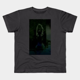 Digital collage, special processing. Strong guy, raised his hands, near big stone. Dark water, mystic. Green and dim. Kids T-Shirt